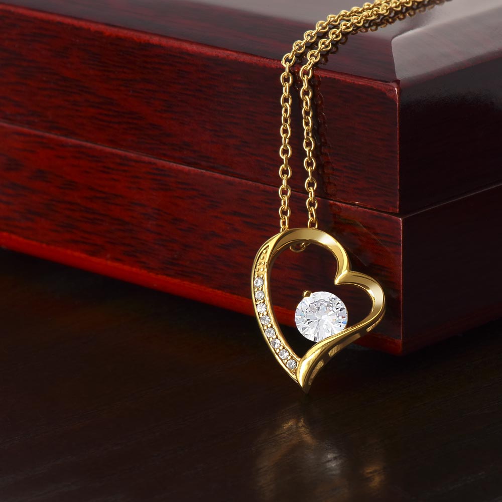A ShineOn Fulfillment "To Mom - You Were My First Friend - Forever Love Necklace" with a diamond in it.
