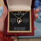 A woman holding an "I Love You Forever Love Necklace - Gift for Wife from Husband" by ShineOn Fulfillment in a box.