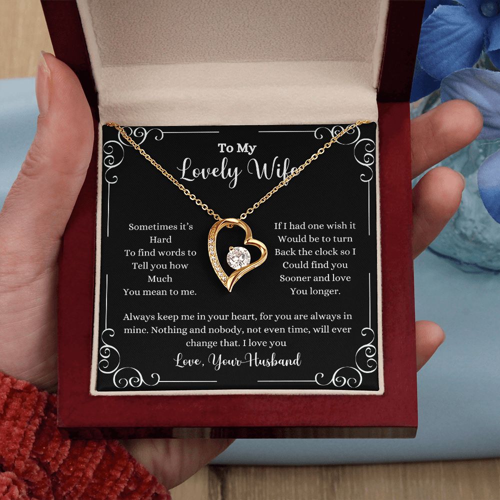 A woman holding a I Love You Forever Love Necklace - Gift for Wife from Husband by ShineOn Fulfillment in a box.