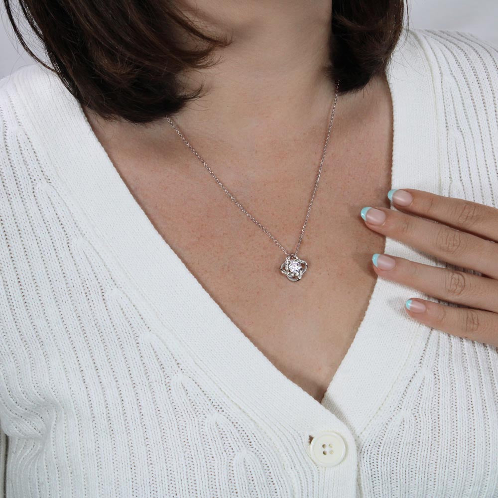 A woman wearing a white sweater and a To My New Mom - I am so lucky to have you in my life - Love Knot Necklace by ShineOn Fulfillment.
