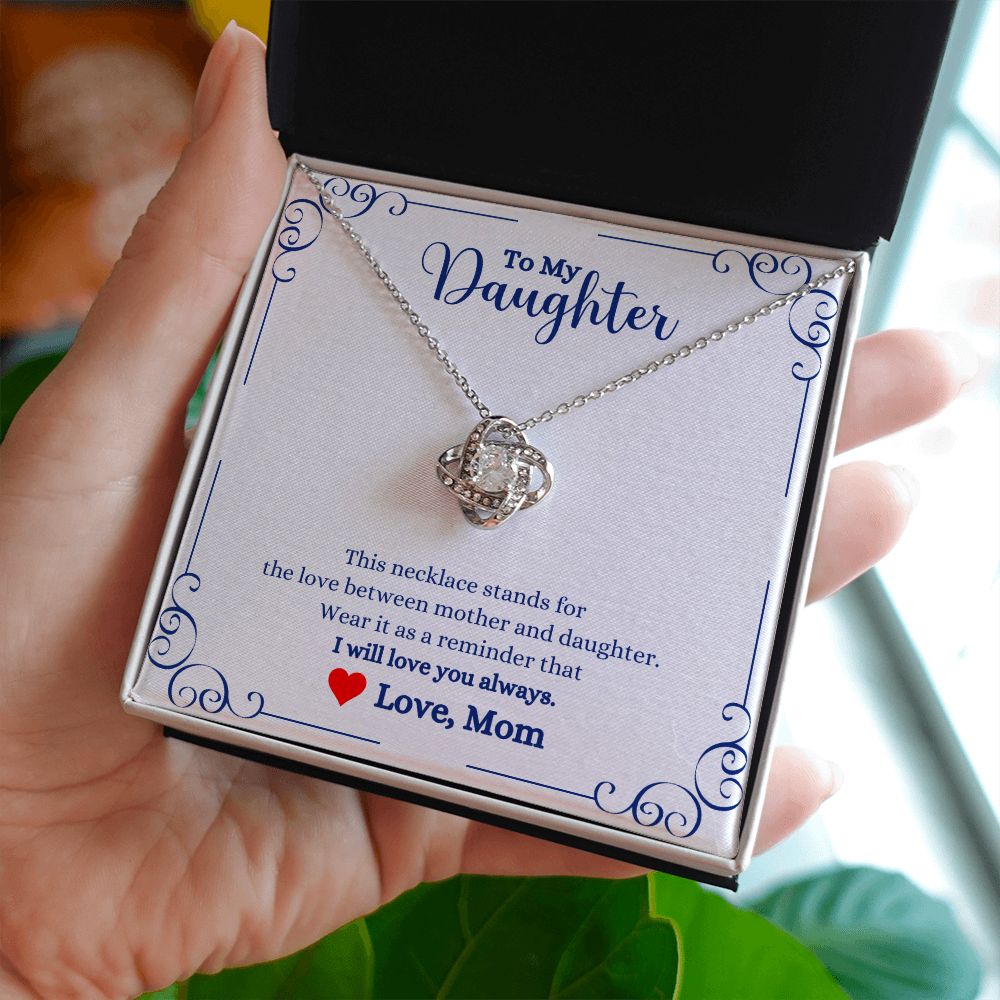 A woman is holding an I Will Always Be With You Love knot Necklace- Gift for Daughter from Mom by ShineOn Fulfillment, with a message for her daughter.