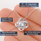 A woman's hand is holding a ShineOn Fulfillment "You Are The Best Friend That I Ever Had Love Knot Necklace For Mom" with a diamond and a lobster clasp.