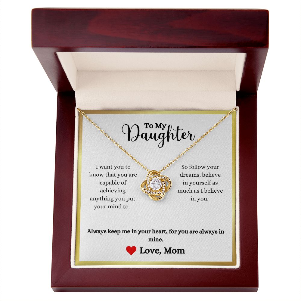 A gift box with an Always Keep Me In Your Heart Love Knot Necklace - Gift for Daughter from Mom by ShineOn Fulfillment that reads, i love my daughter.