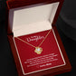 A red box with a ShineOn Fulfillment Love Knot Necklace - for Daughter from Mom in it.