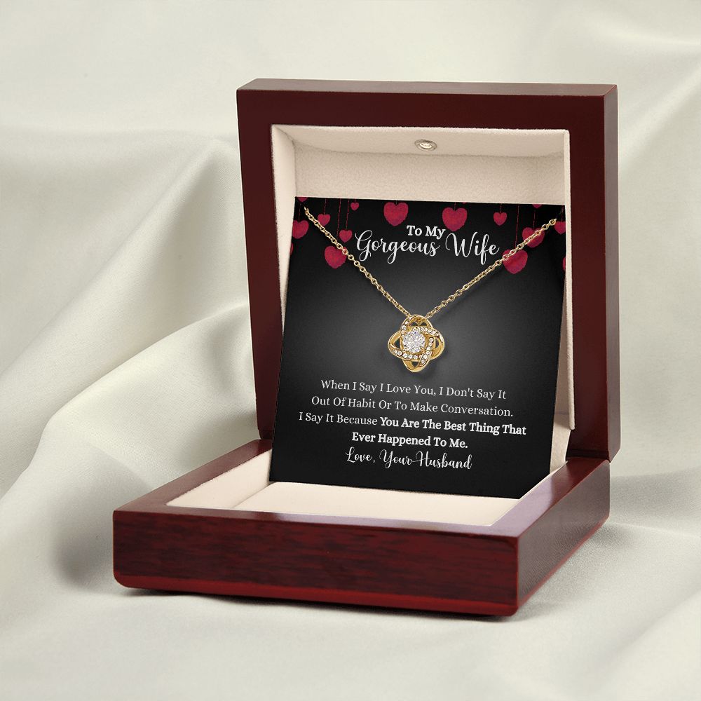 A wooden box with a When I Say I Love You Love Knot Necklace - For Wife by ShineOn Fulfillment in it.