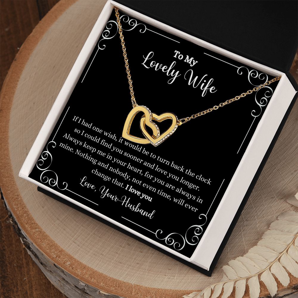 A ShineOn Fulfillment gift box with an I Love You Interlocking Hearts Necklace and a gift card.