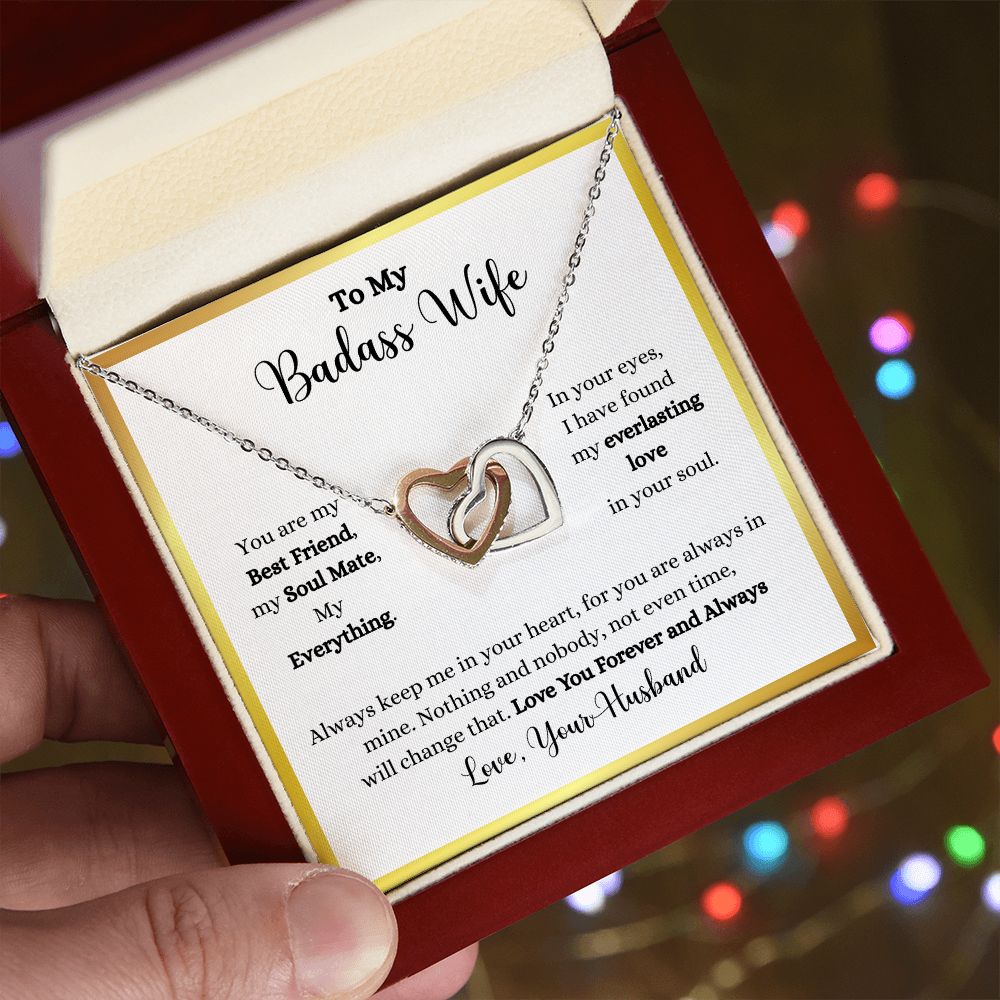 A person holding a gift box with an Always Keep Me In Your Heart Interlocking Hearts necklace - Gift for Wife from Husband by ShineOn Fulfillment in it.