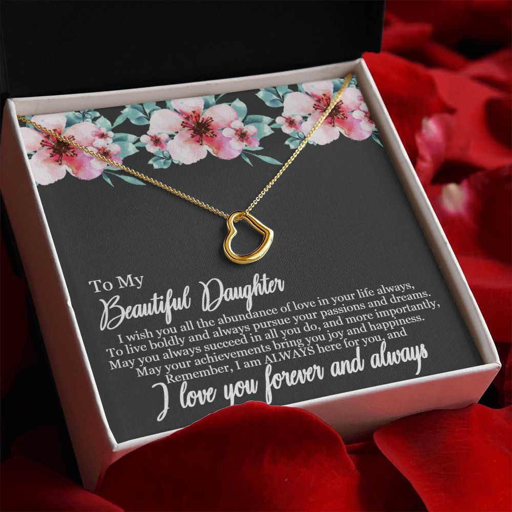 A box with the "I Wish You All The Abundance of Love - Delicate Heart Necklace For Daughter" from ShineOn Fulfillment and roses in it.