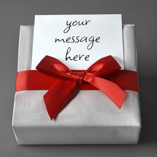 A ShineOn Fulfillment gift box with a red ribbon and a note inside containing Gift Wrap with Personalized Message.