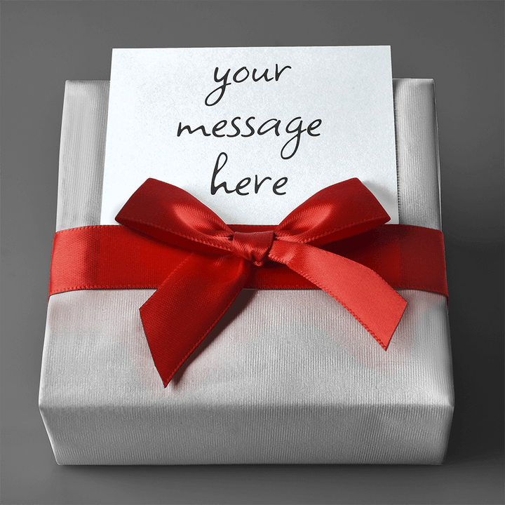 A ShineOn Fulfillment gift box with a red ribbon and a note inside containing Gift Wrap with Personalized Message.