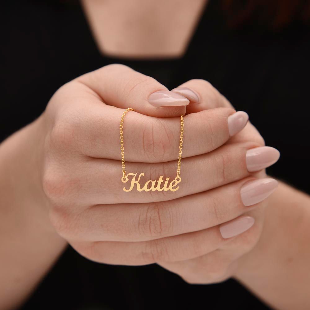 A woman holding a "I am luckiest Personalized Name Necklace - For Soulmate" from ShineOn Fulfillment.
