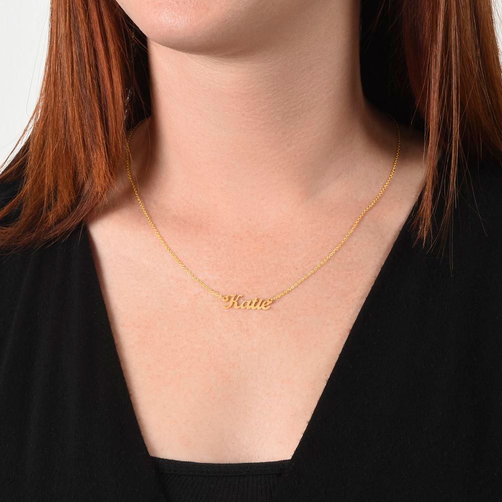 A woman wearing a gold necklace with the words "I am luckiest" and "Soulmate" on it, made by ShineOn Fulfillment.