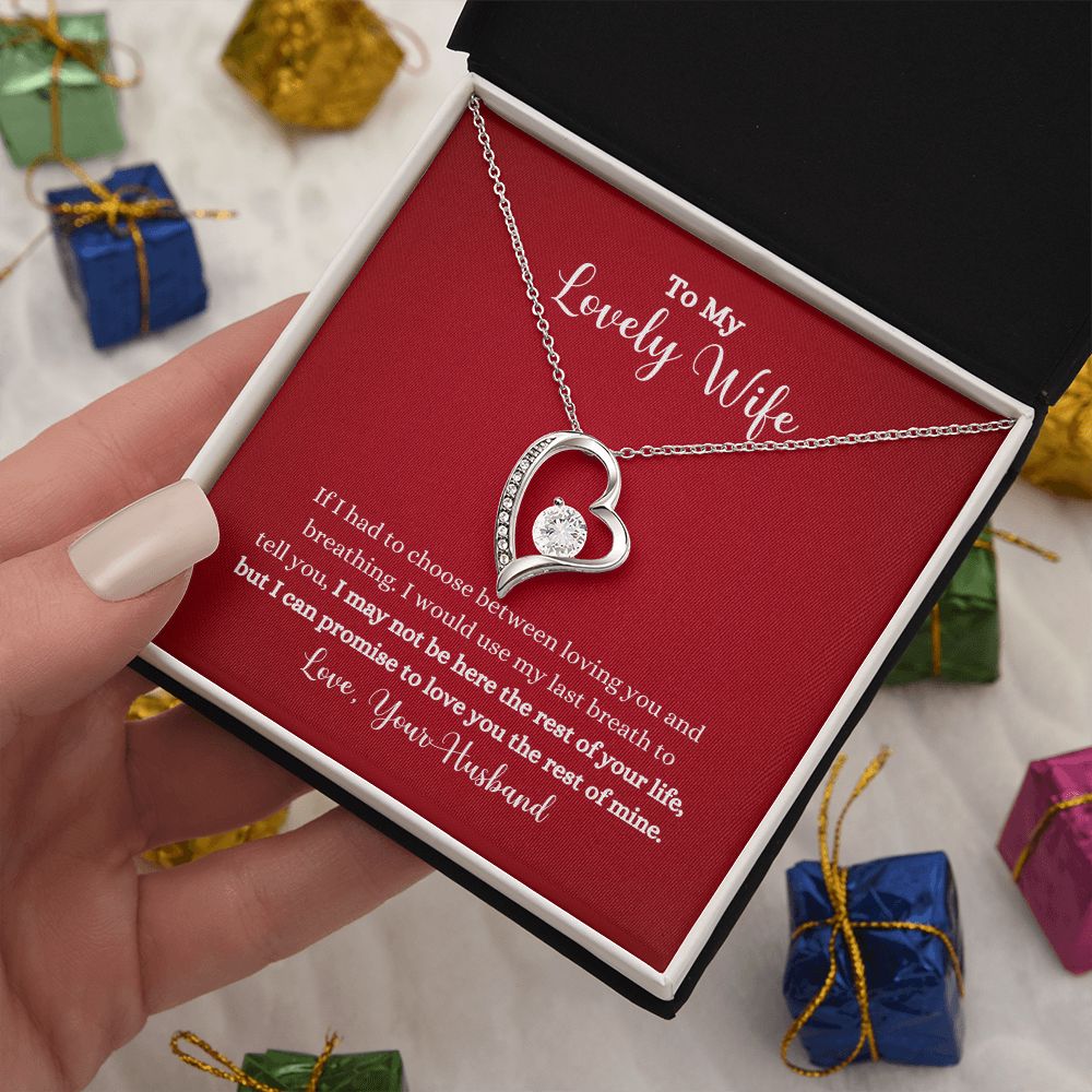 A person holding a Love You The Rest of Mine Forever Love Necklace - Gift for Wife from Husband in a ShineOn Fulfillment gift box.