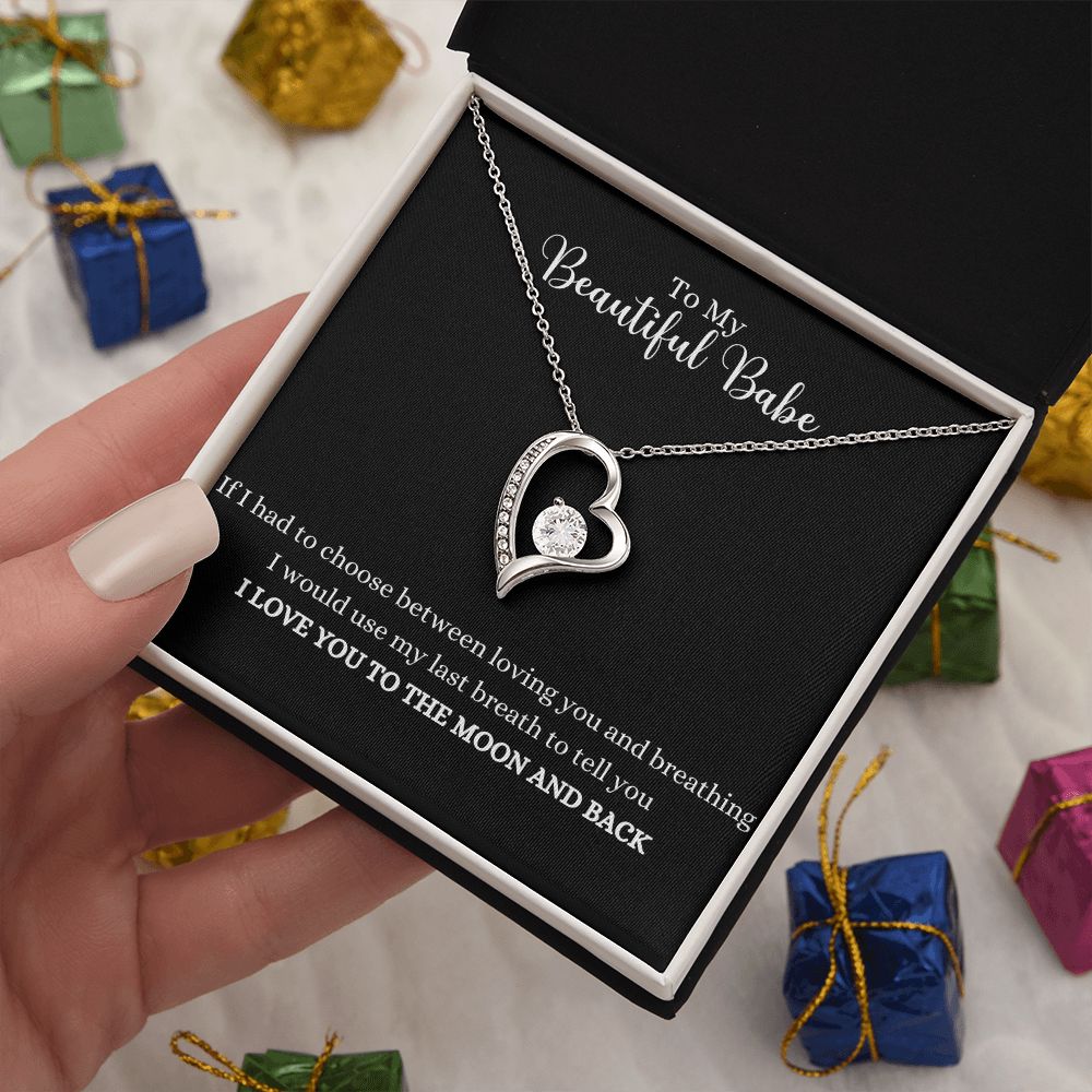 A woman is holding a Love you to the moon and back Forever Love Necklace - For Soulmate or Wife by ShineOn Fulfillment in a gift box.