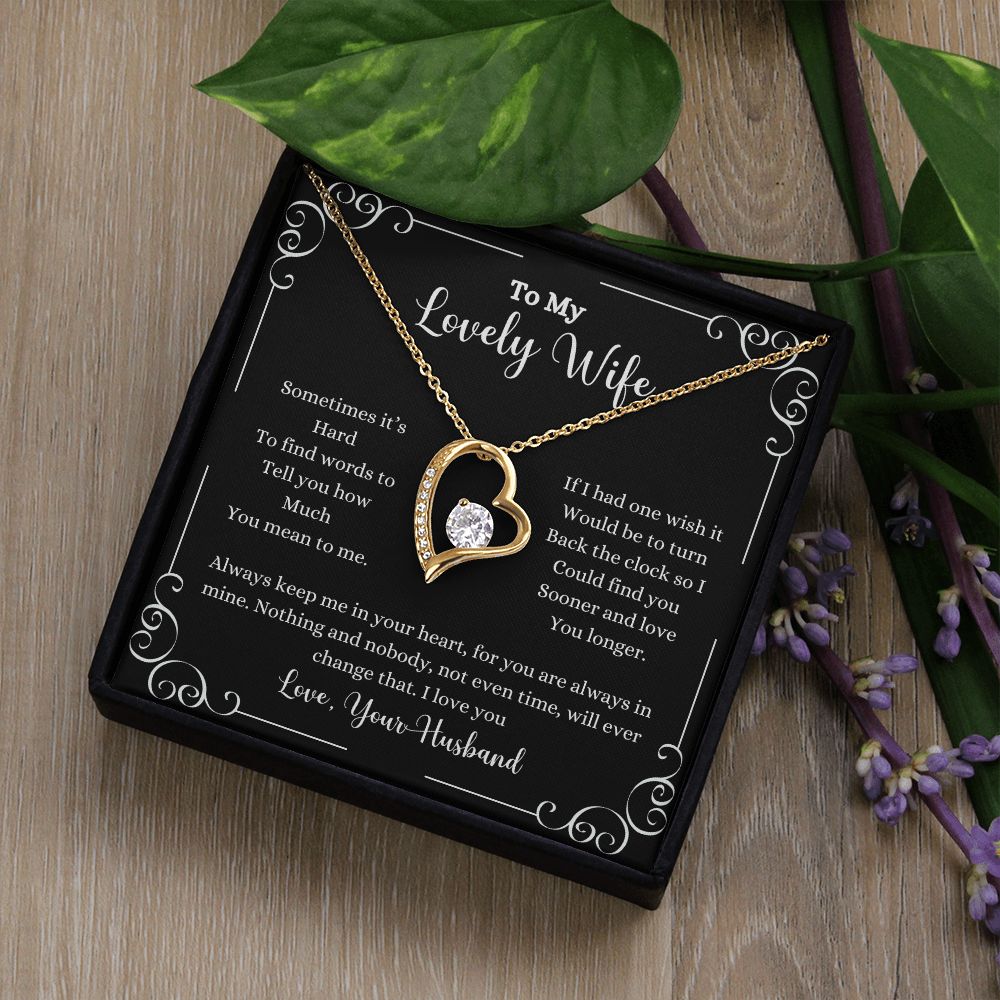 A black I Love You Forever Love Necklace - Gift for Wife from Husband box with a heart shaped necklace and flowers by ShineOn Fulfillment.
