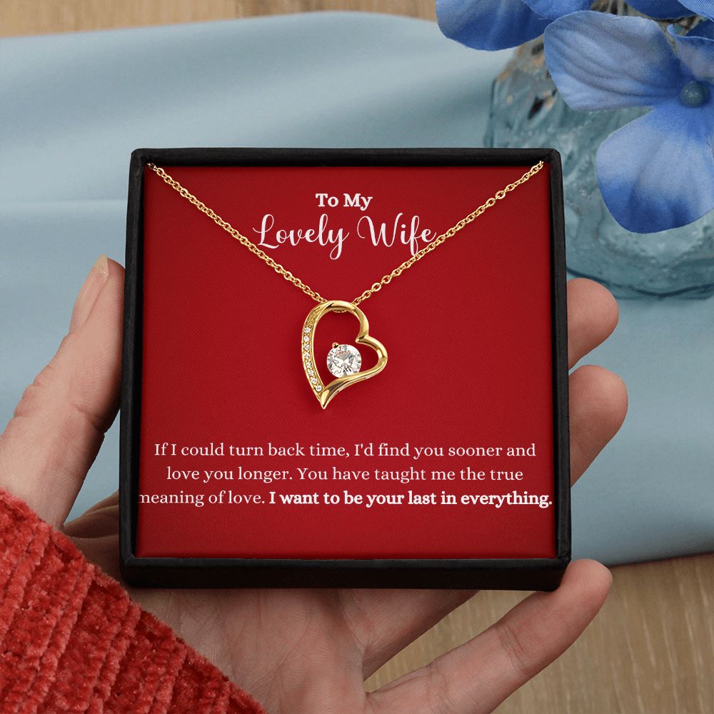 A woman holding a I Want To Be Your Last In Everything Forever Love Necklace - To Wife from Husband in a red box.