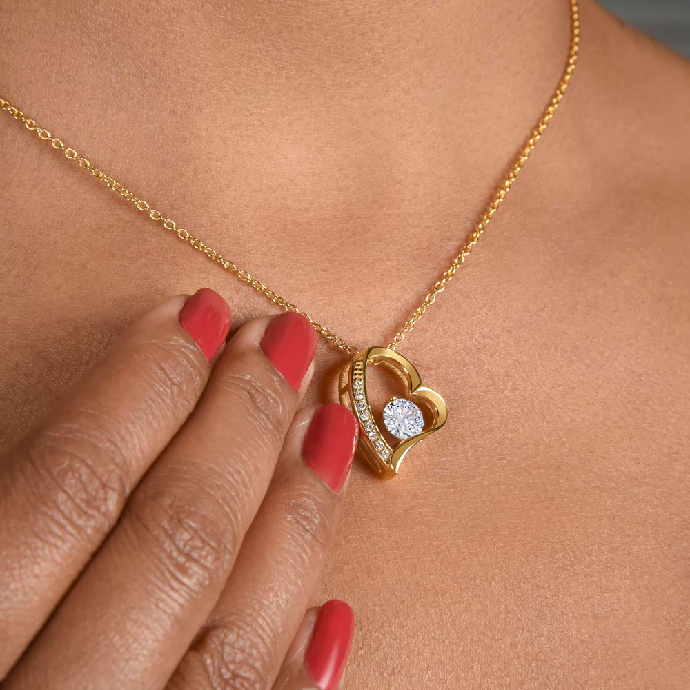 A woman wearing a ShineOn Fulfillment To My Queen Forever Love Necklace - For Soulmate, Girlfriend or Wife with a diamond heart pendant.