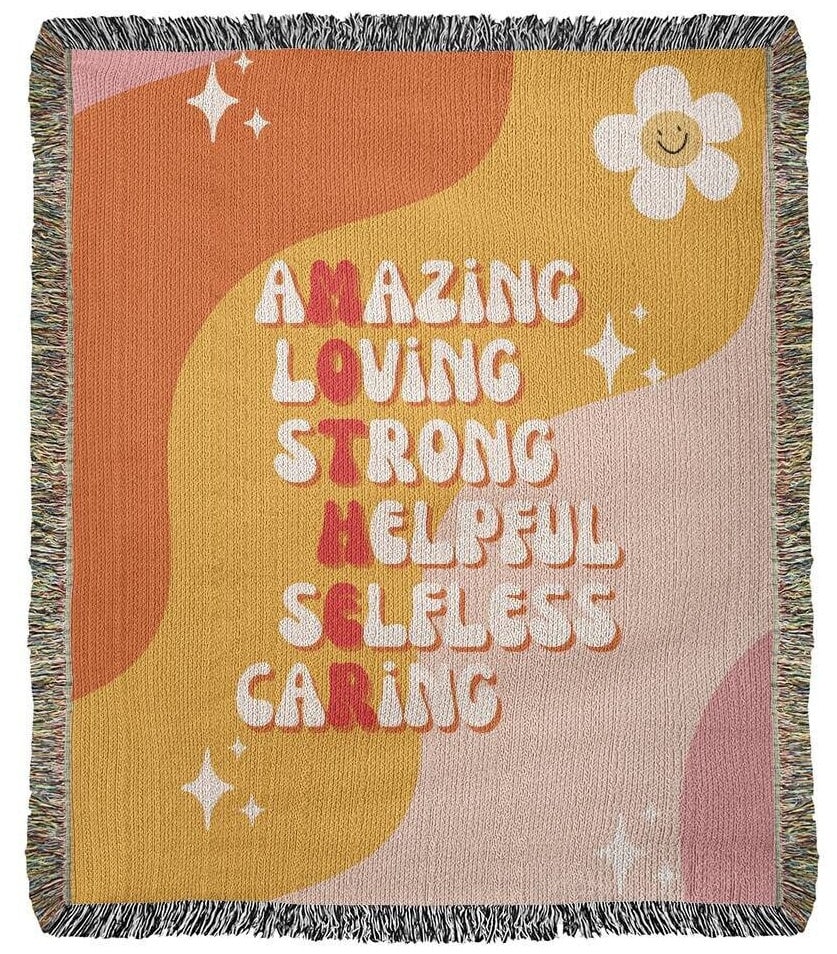 A colorful tapestry, perfect as a gift for a mother, woven with words of self-care and strength: the Golden Value SG Amazing Loving Mother Definition Heirloom Woven Blanket.