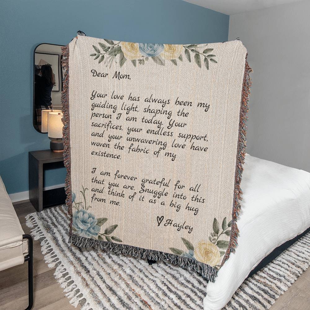 A bed with a Personalized Note to Mom Heirloom Woven Blanket from Golden Value SG for mom.