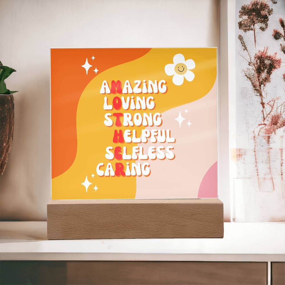 An orange and yellow Golden Value SG acrylic plaque with the words amazing, loving, strong, empathetic, caring.