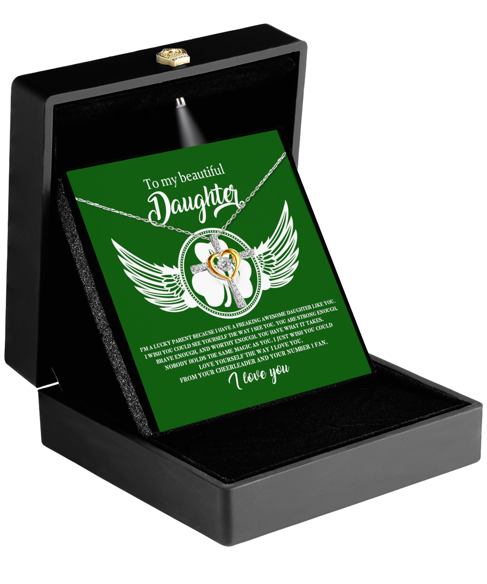 A green box with a shamrock and wings, adorned with a Gearbubble To My Daughter, Lucky Parent - Cross Dancing Necklace.