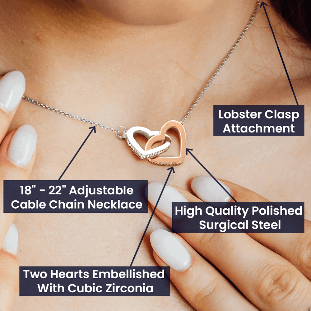 A woman is holding a ShineOn Fulfillment I Love You Forever And Always Interlocking Hearts necklace - Gift for Daughter from Mom with a lobster clasp.
